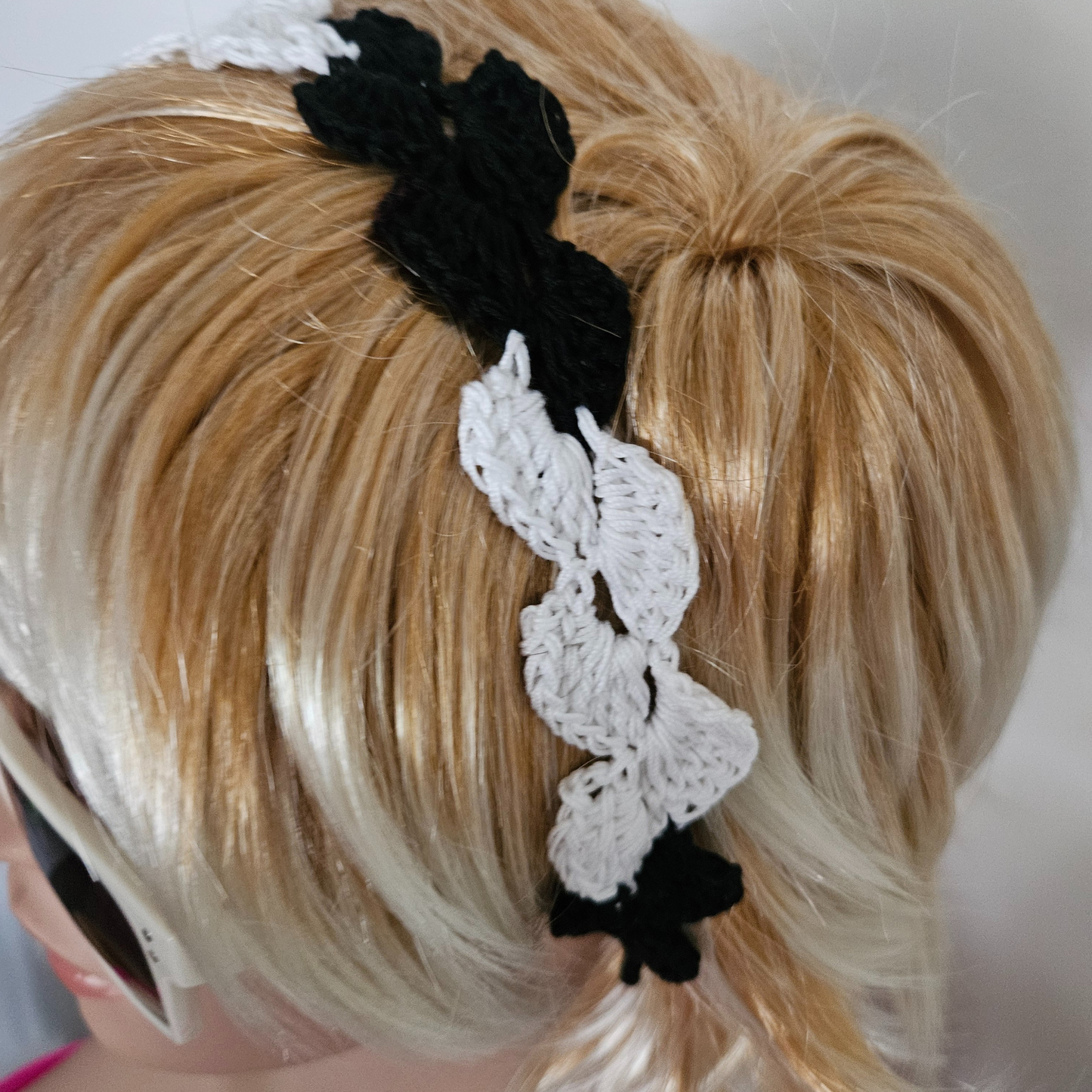 Black & white petal headband model side posing