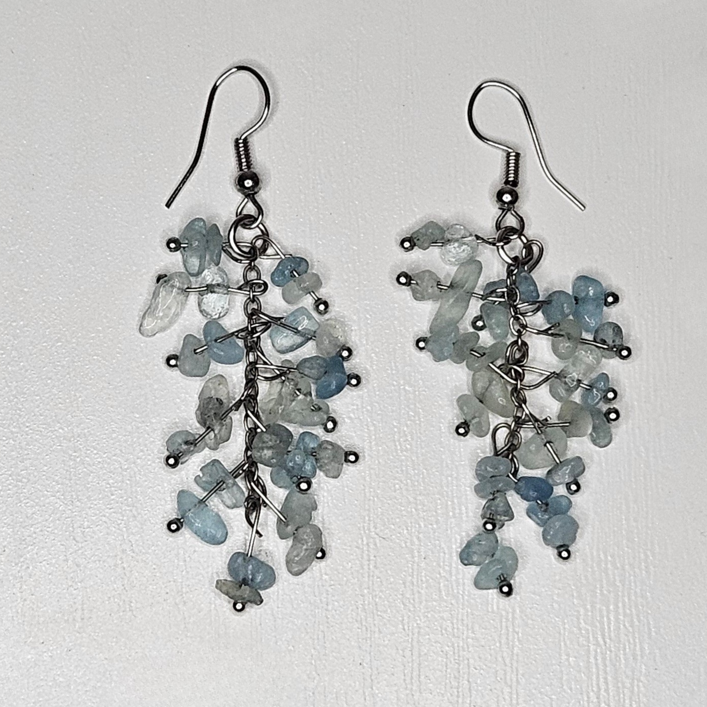 Turquoise and sodalite blue gemstone earrings with natural tumbled stones—boho chic, lightweight, and ideal for tropical beach vacations or casual summer looks.