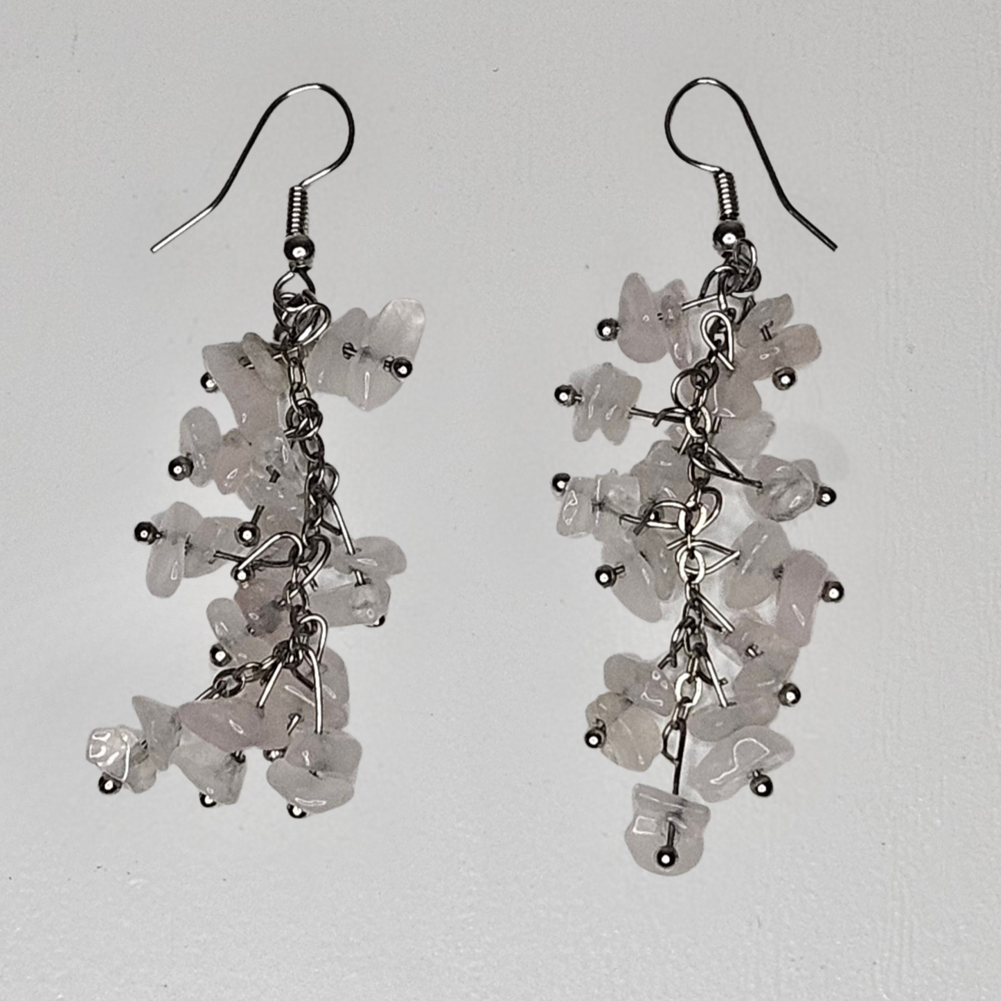 Pink rose quartz earrings featuring natural tumbled stones, lightweight and comfortable handcrafted jewelry for beachwear or boho outfits