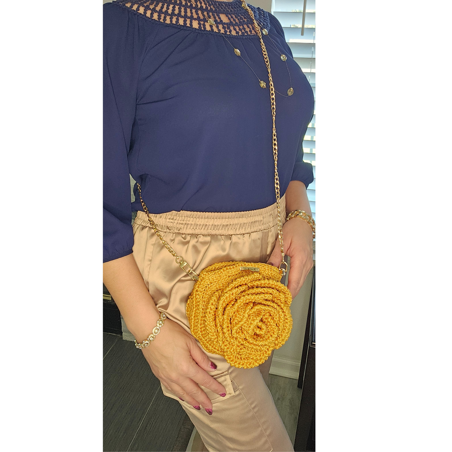 Model showcasing Gold Petite Bloom Macramé Tote – handmade mini floral bag with 3D crochet design, lightweight crossbody gold chain strap, perfect for spring and summer outfits.
