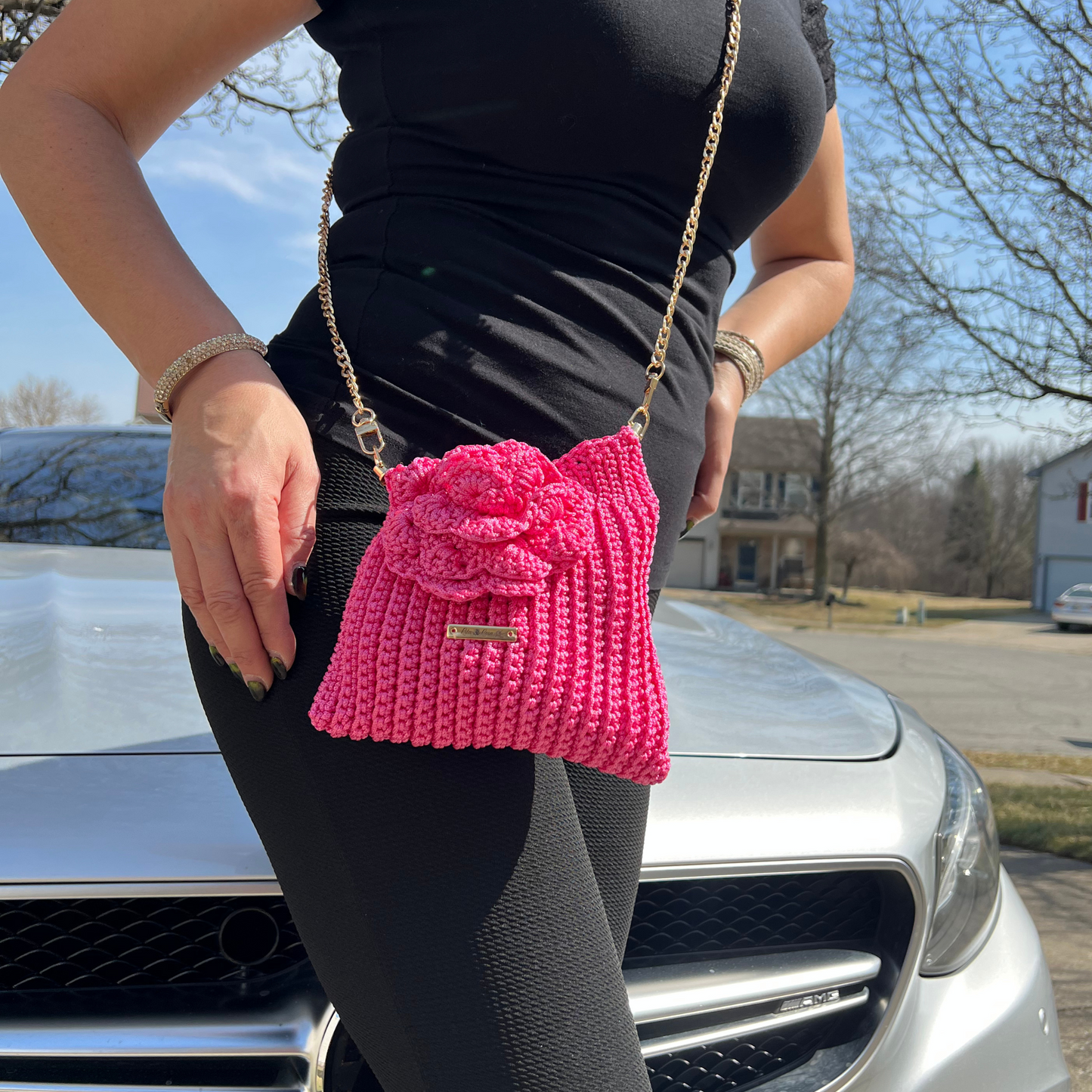 Model showcasing Pink Flora Bloom Crochet Crossbody Bag – handmade floral statement bag, lightweight macramé design, perfect for spring and summer outfits.