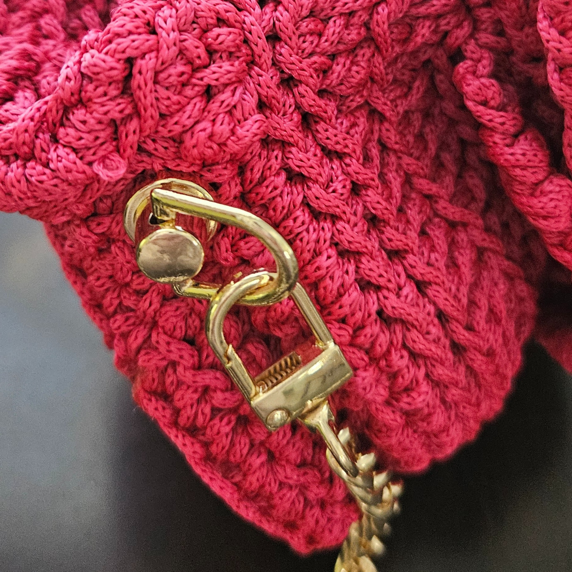Close up of the Red Bloom crossbody D Rectangular Metal Handle shape keychain