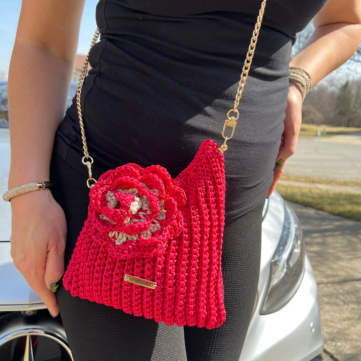 Model showcasing Red Flora Bloom Crochet Crossbody Bag – handmade floral statement bag, lightweight macramé design, perfect for spring and summer outfits.