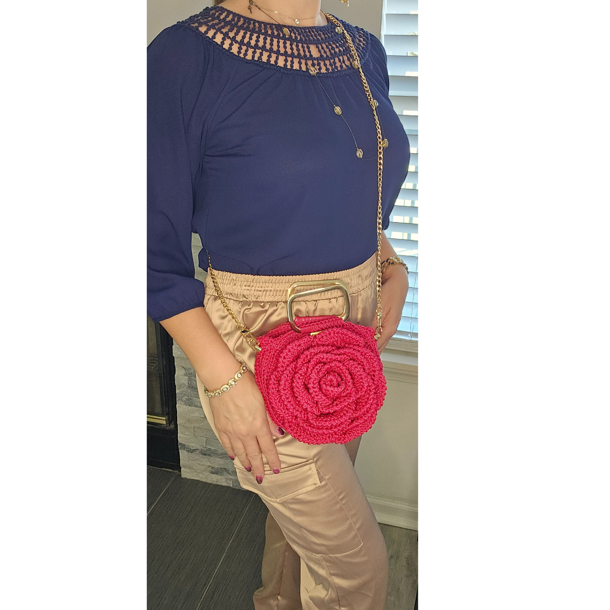 Model showcasing Red Rosa Bloom Macramé Crossbody – handmade 3D rose design bag, lightweight macramé craftsmanship with gold chain strap, perfect for Mother's Day, weddings, and summer outfits.