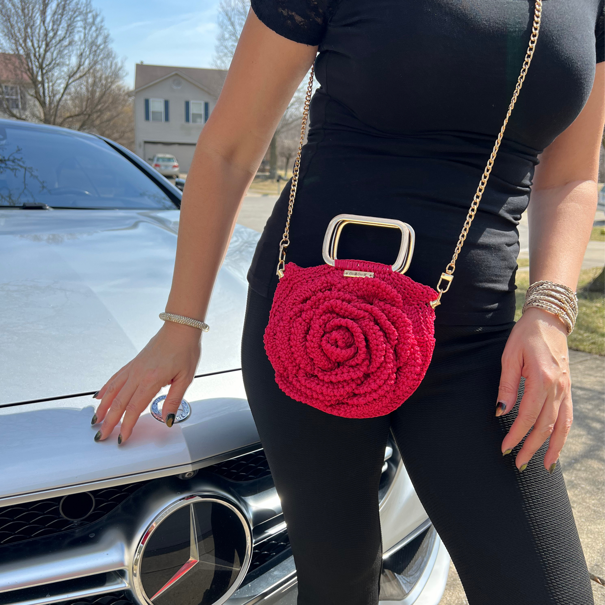 Fashion model showcasing the Rosa Bloom Macramé Crossbody – Chic handcrafted bag, stylish statement piece for modern women, perfect for special occasions and everyday wear.