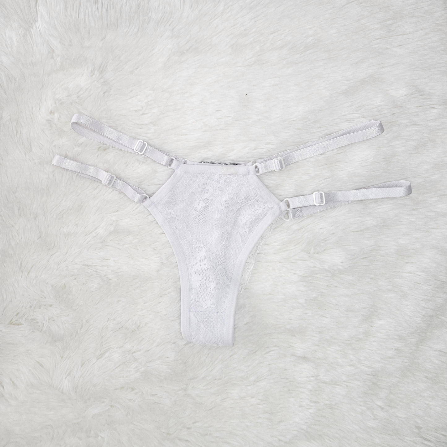 Front view of white Brilho Strappy Lace G-String and adjustable four-strap system
