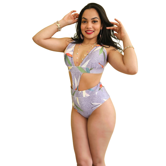 Stylish purple swimsuit with seashell pattern, side cut-out, and crisscross back ties