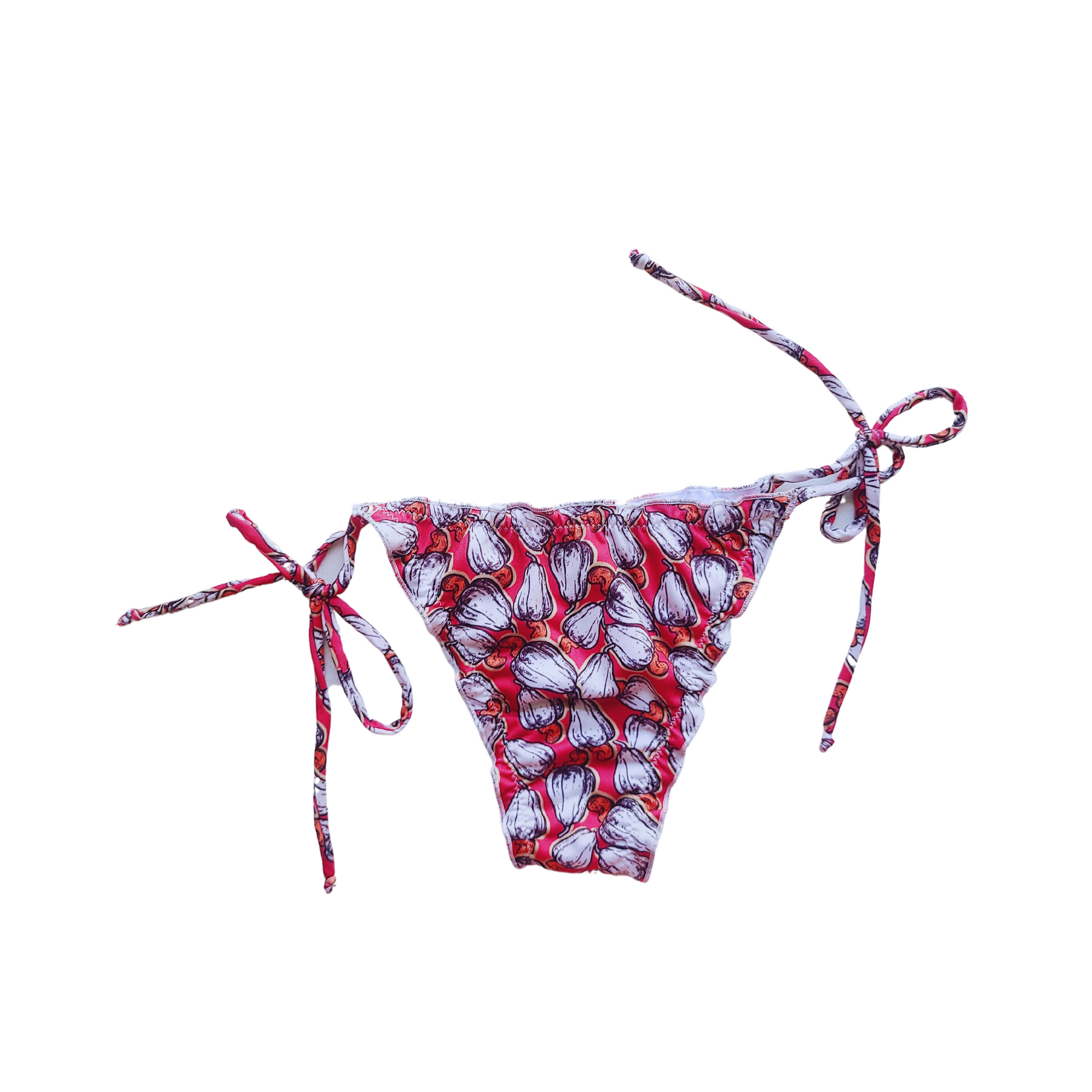 Woman wearing a cajun print bikini set with tie straps, ruffled details, and neck ties, perfect for a stylish and comfortable day at the beach or pool.
