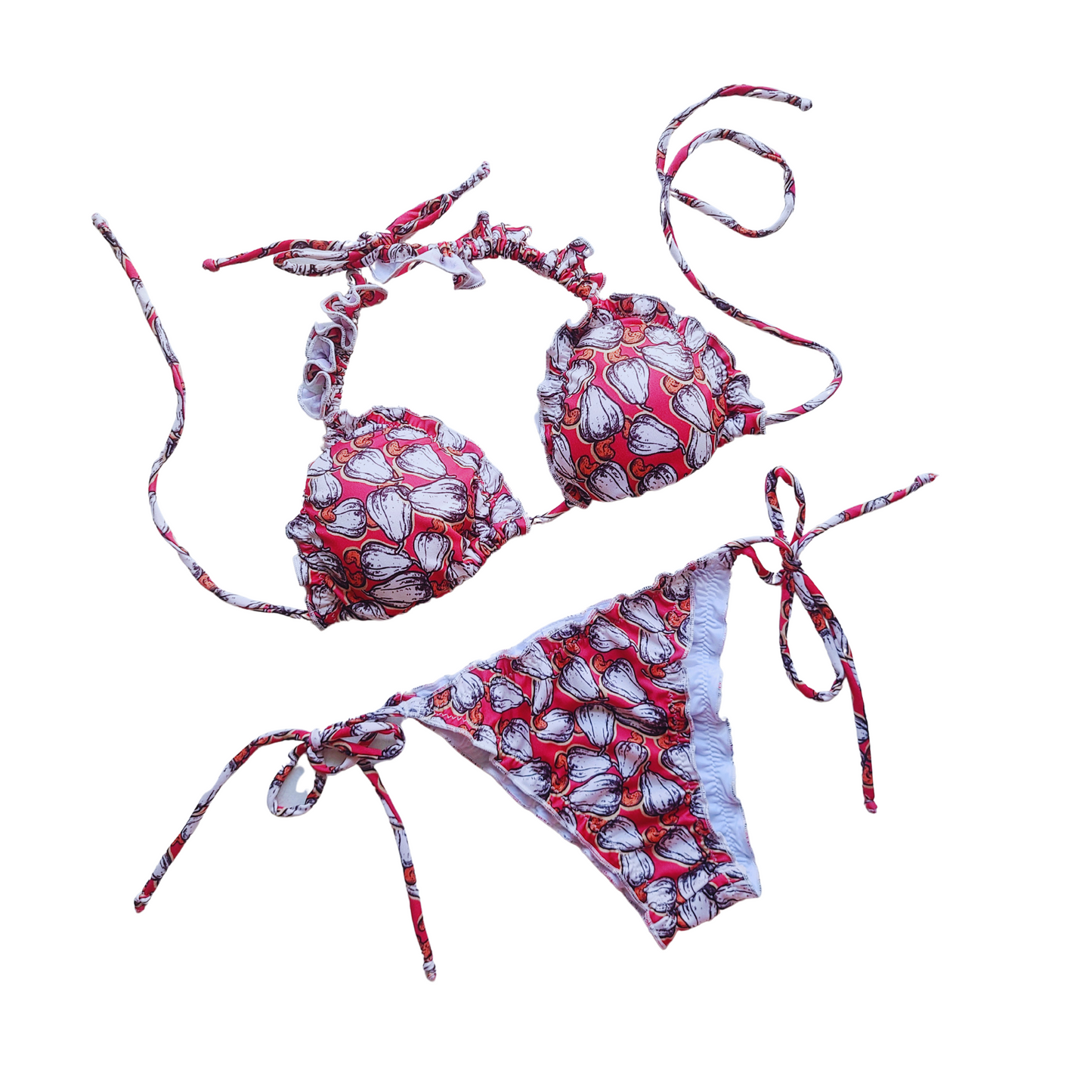 Woman wearing a cajun print bikini set with tie straps, ruffled details, and neck ties, perfect for a stylish and comfortable day at the beach or pool.