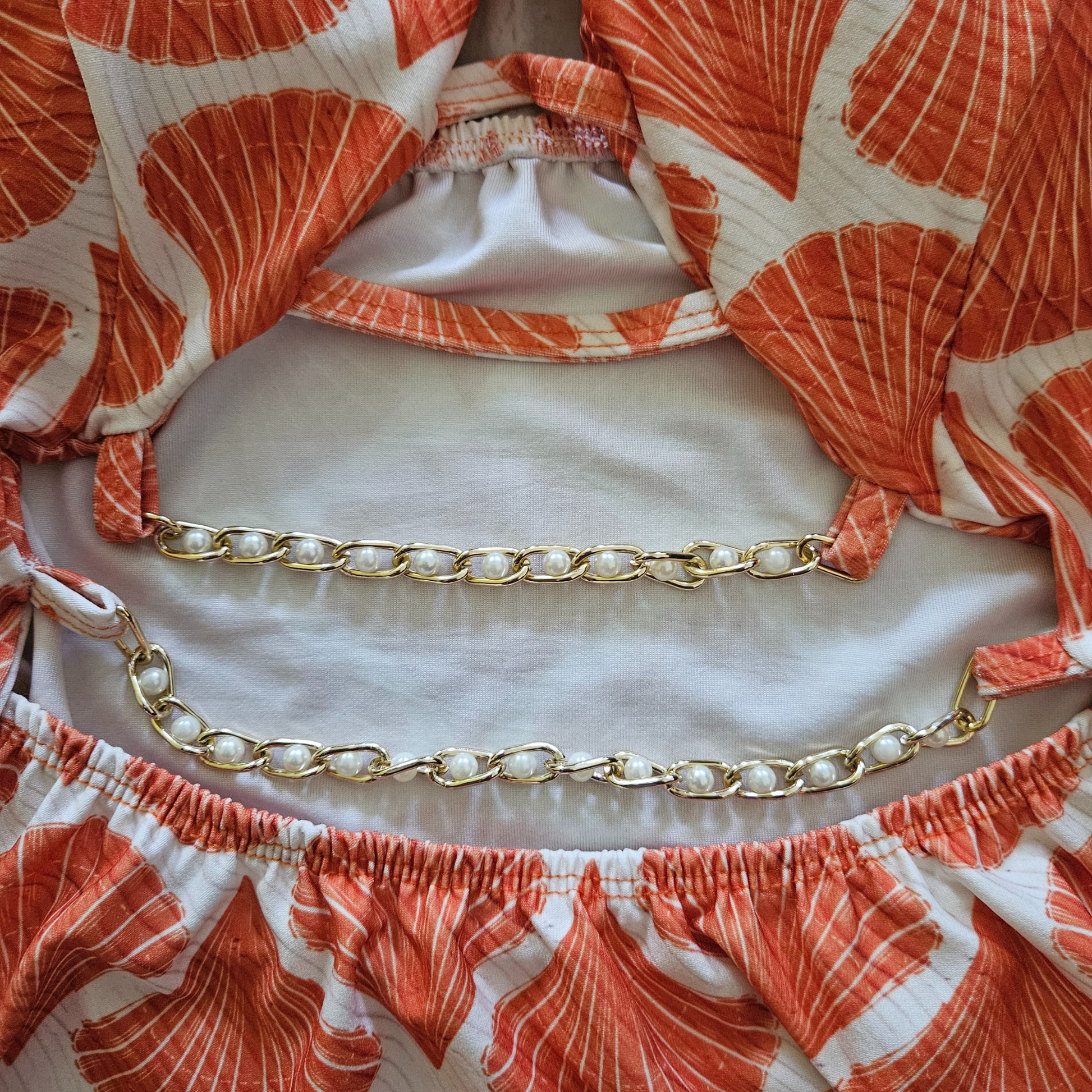 Orange Pearls Accent Cut Out One-Piece Swimsuit closeup pearls image