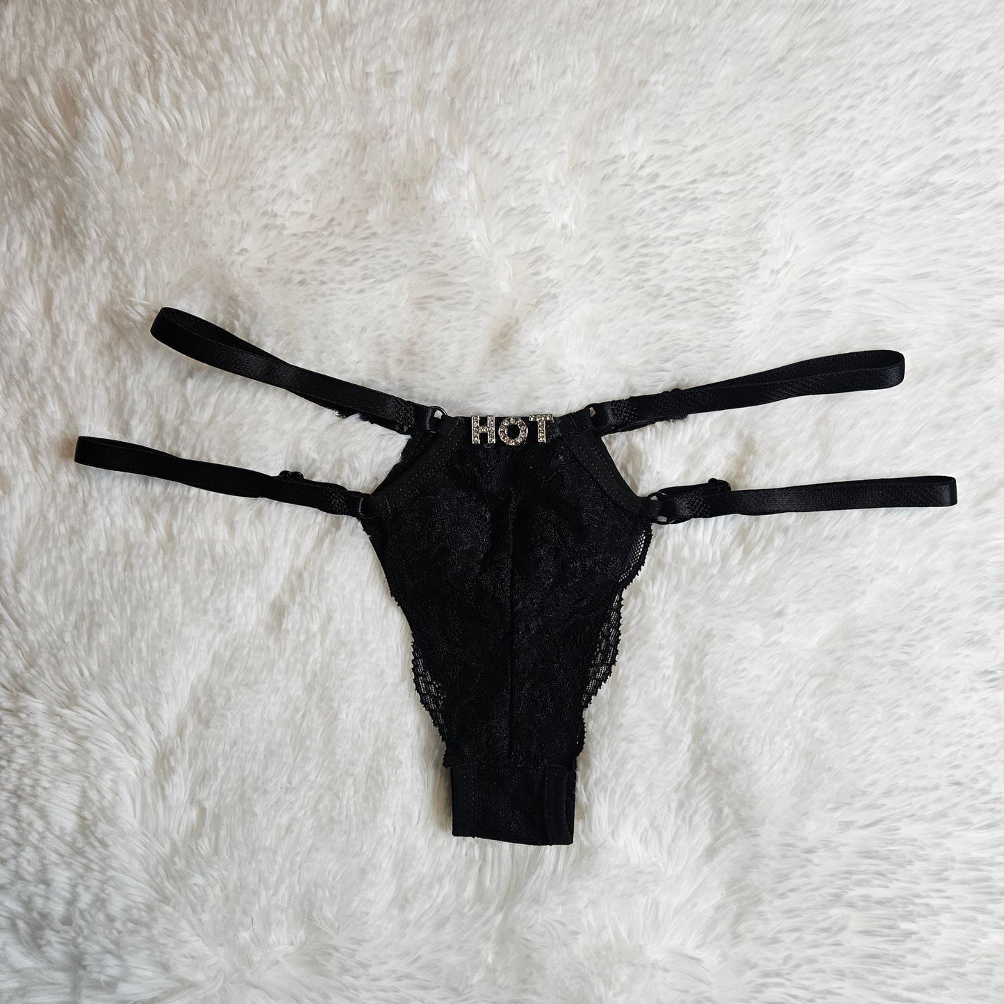 Boutique black floral lace G-string with a HOT rhinestone statement and signature gold-toned adjustable sliders