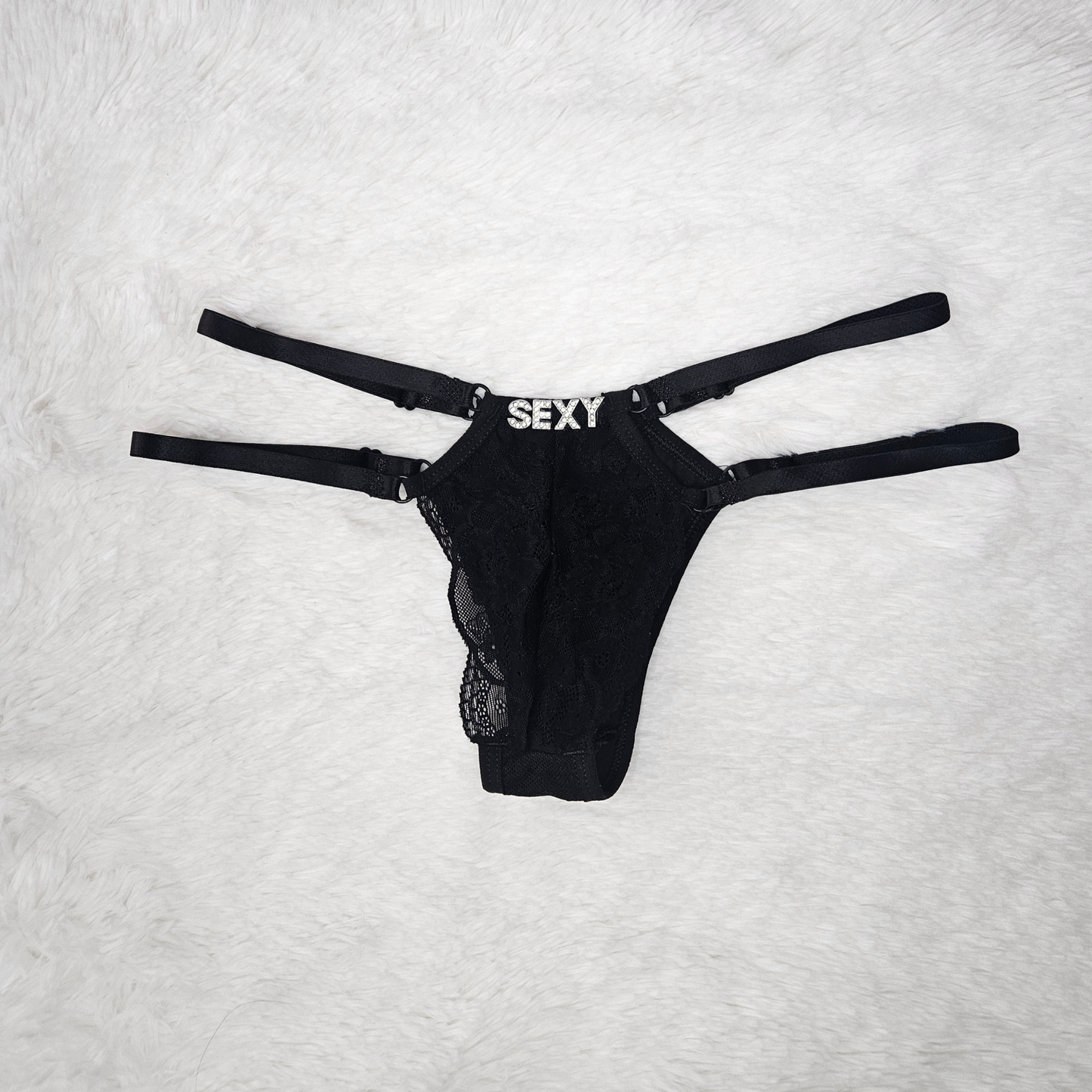 Boutique black floral lace G-string with a SEXY rhinestone statement and signature gold-toned adjustable sliders.