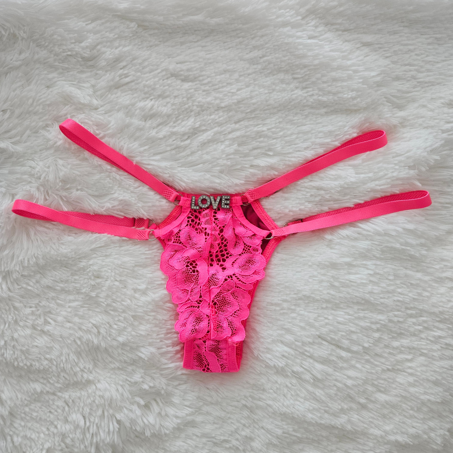 Rita Rosa pink floral lace statement G-string featuring a LOVE rhinestone word and premium adjustable four-strap system