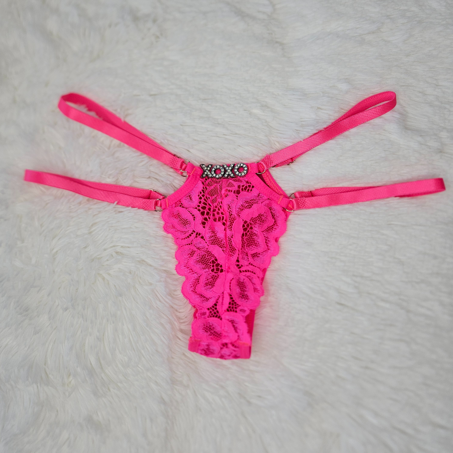 Rita Rosa pink floral lace statement G-string featuring a XOXO rhinestone word and premium adjustable four-strap system