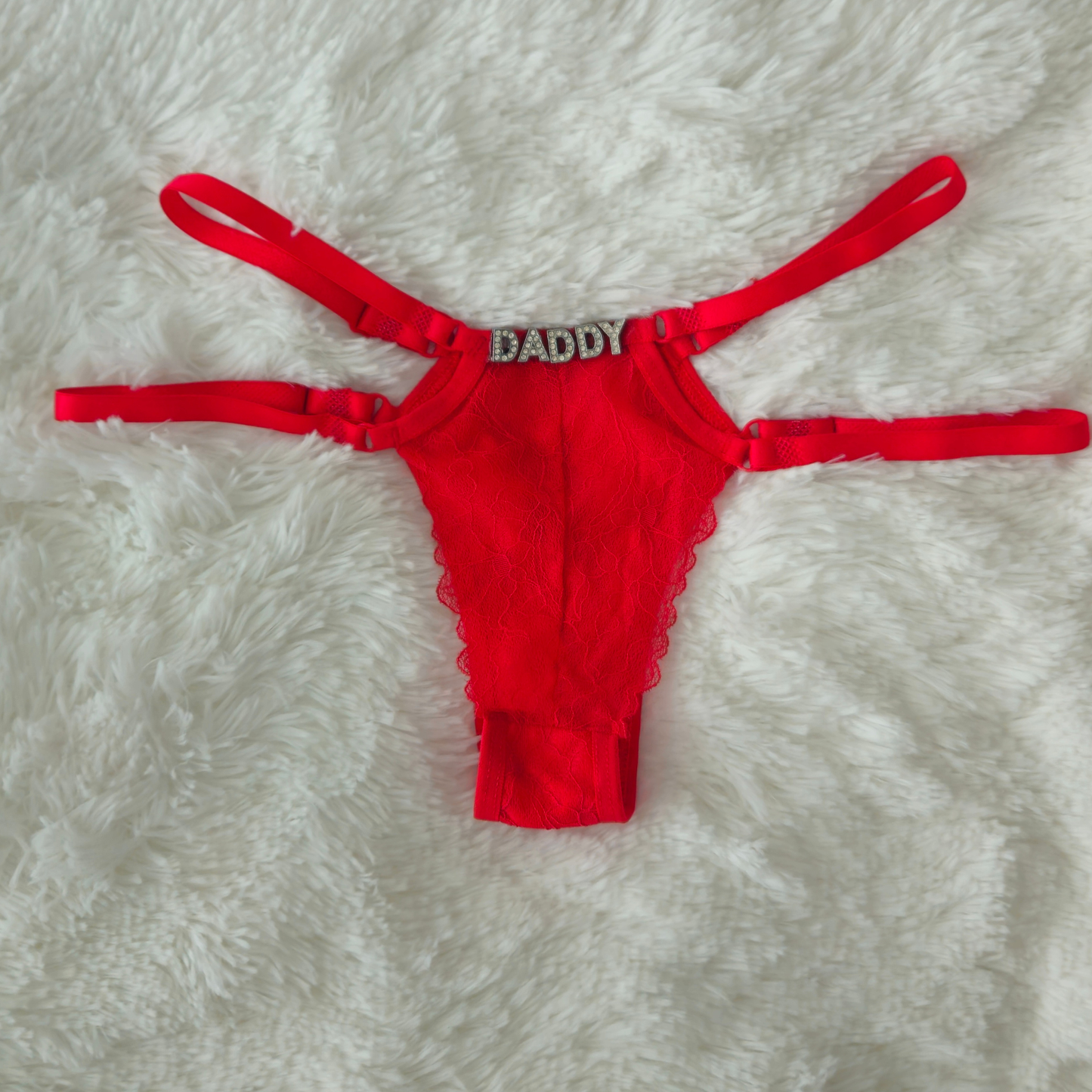 Limited edition red strappy lace G-string from the Brilho collection with DADDY crystal hardware and architectural double-strap design.