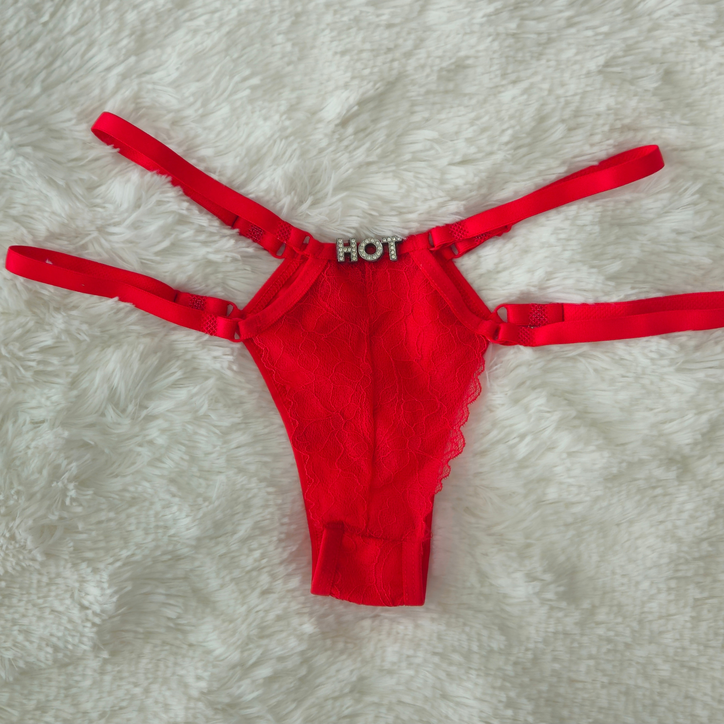 Limited edition red strappy lace G-string from the Brilho and architectural double-strap design.