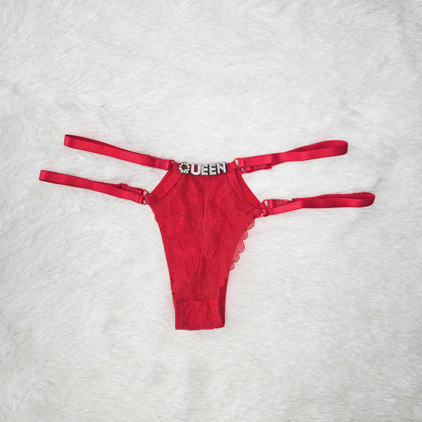 Limited edition red strappy lace G-string from the Brilho collection with QUEEN crystal hardware and architectural double-strap design.