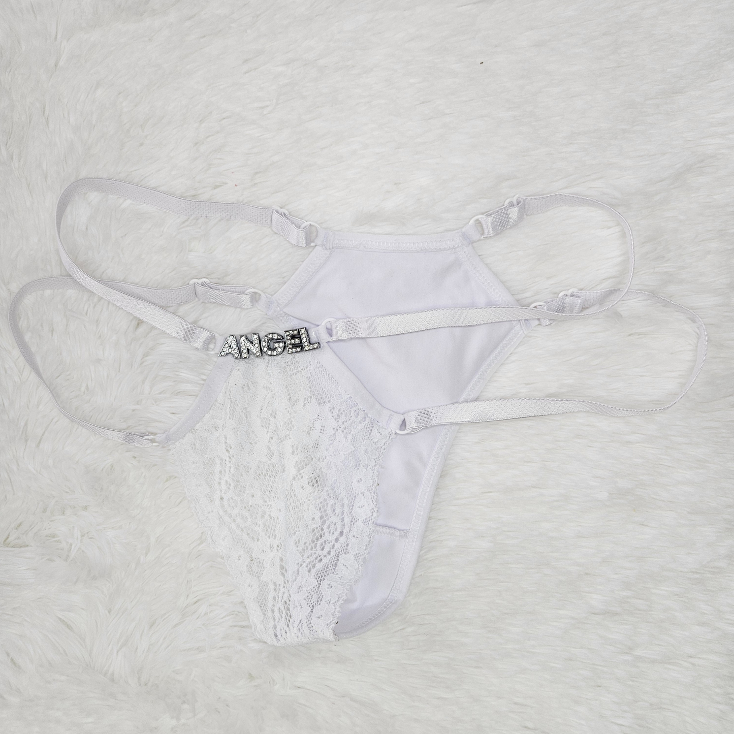 Back view of white Brilho Strappy Lace G-String with ANGEL rhinestone hardware and adjustable four-strap system