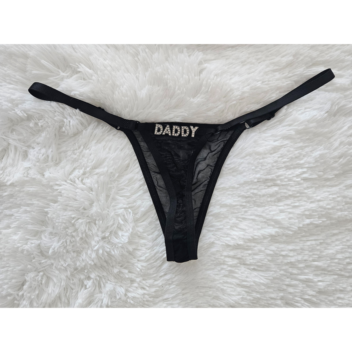 Rita Rosa black sheer mesh thong featuring DADDY jewelry-grade crystal letters.