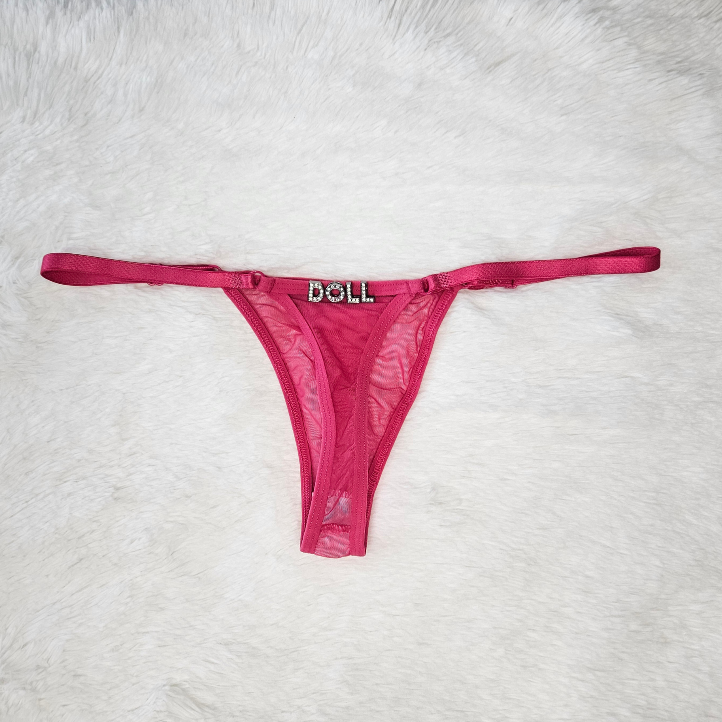Hand-finished pink Brazilian lace G-string with DOLL rhinestone statement charm