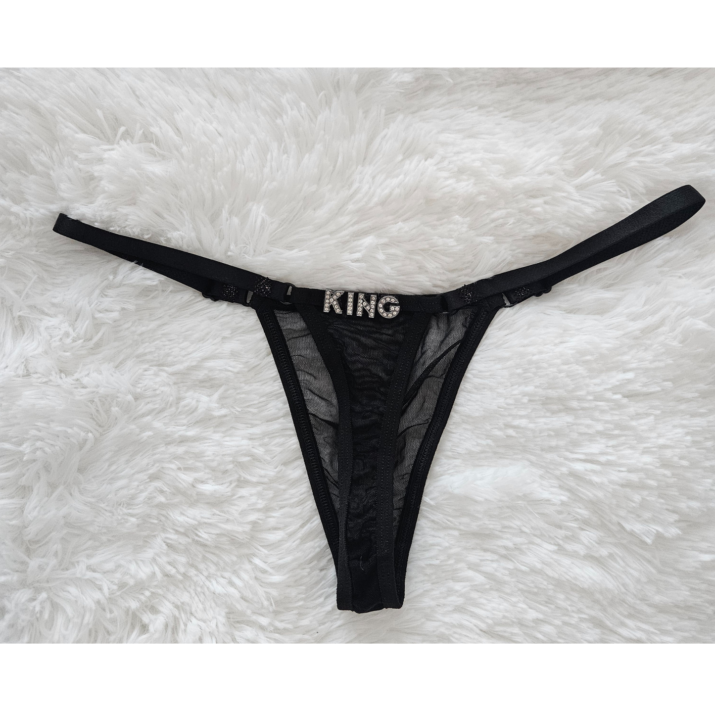 Rita Rosa black sheer mesh thong featuring KING jewelry-grade crystal letters.