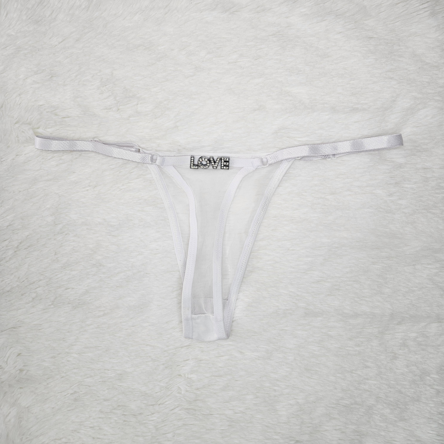 White sheer Brazilian mesh G-string with hand-applied LOVE rhinestone statement.