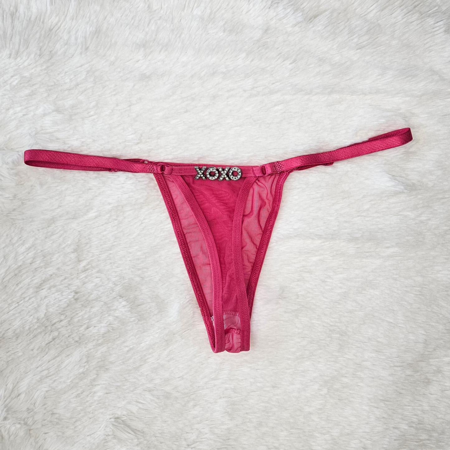 Pink sheer Brazilian mesh G-string with hand-applied XOXO rhinestone statement.