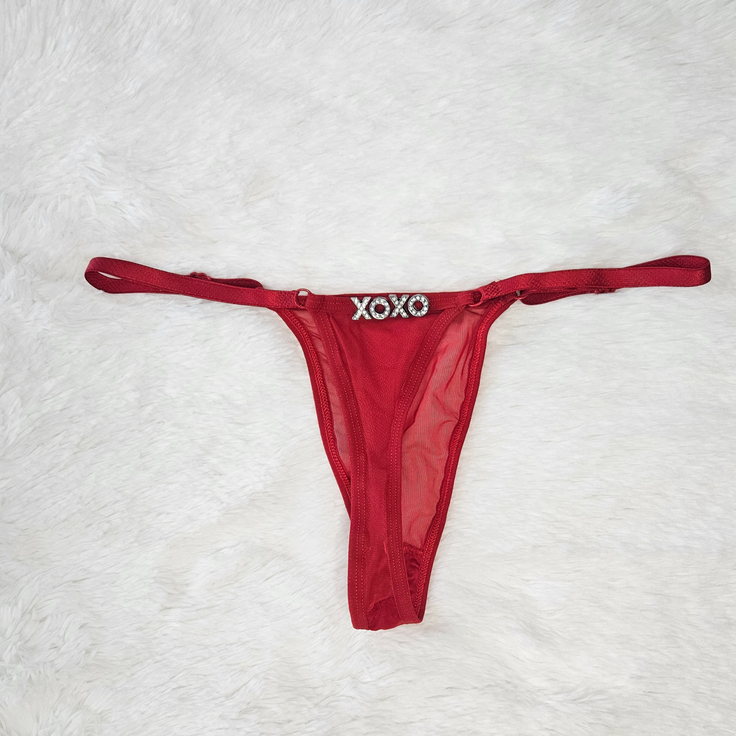 Red sheer Brazilian mesh G-string with hand-applied XOXO rhinestone statement.
