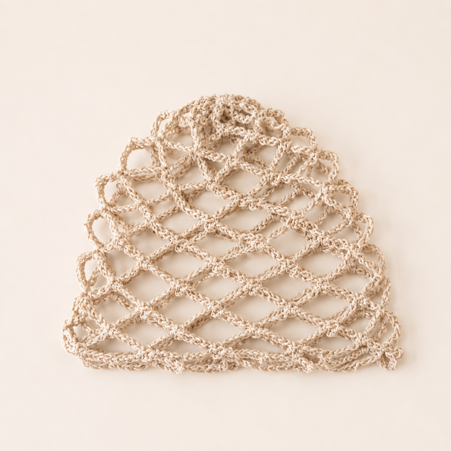 Beige handmade mesh crochet cap by Rita Rosa Brazilian Beachwear featuring lightweight open crochet design for summer beachwear styling.
