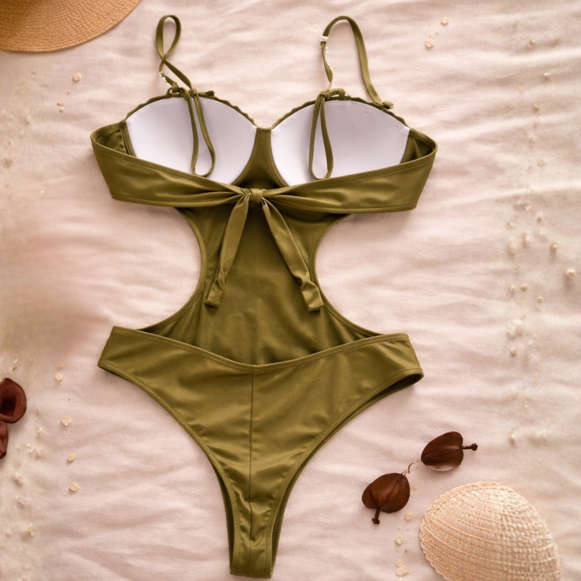 Green Brazilian one-piece swimsuit back view with tie bow and pearl straps, cheeky cut