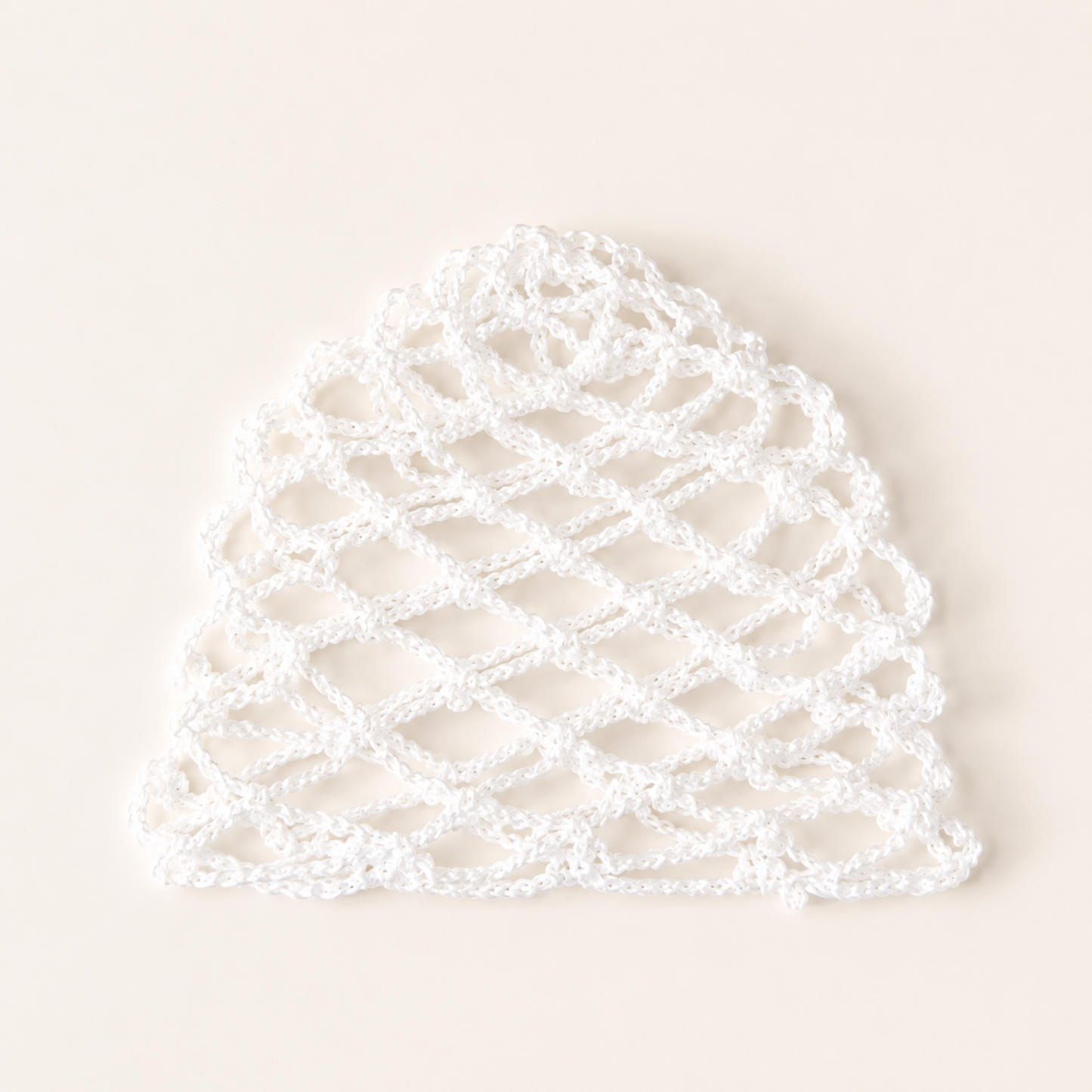 Handmade white mesh crochet cap by Rita Rosa Brazilian Beachwear featuring lightweight boho fishnet crochet styling for beach and festival outfits.