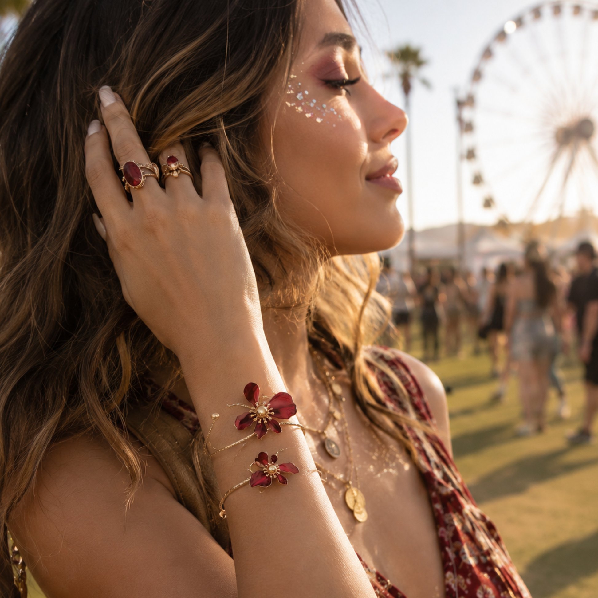 Model wearing ruby red floral gold cuff bracelet on wrist.