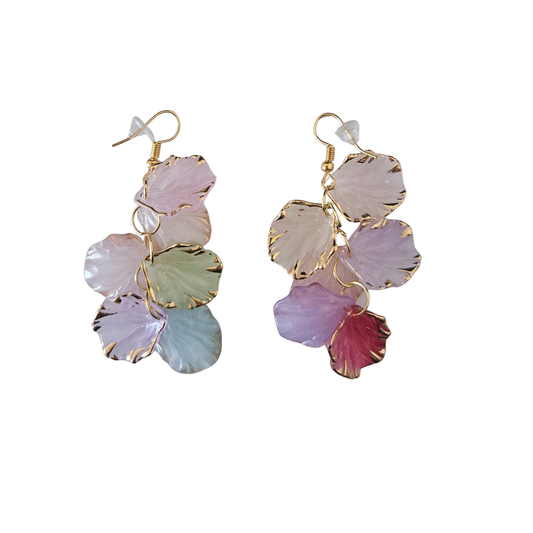 Colorful leaf-shaped earrings on a white background