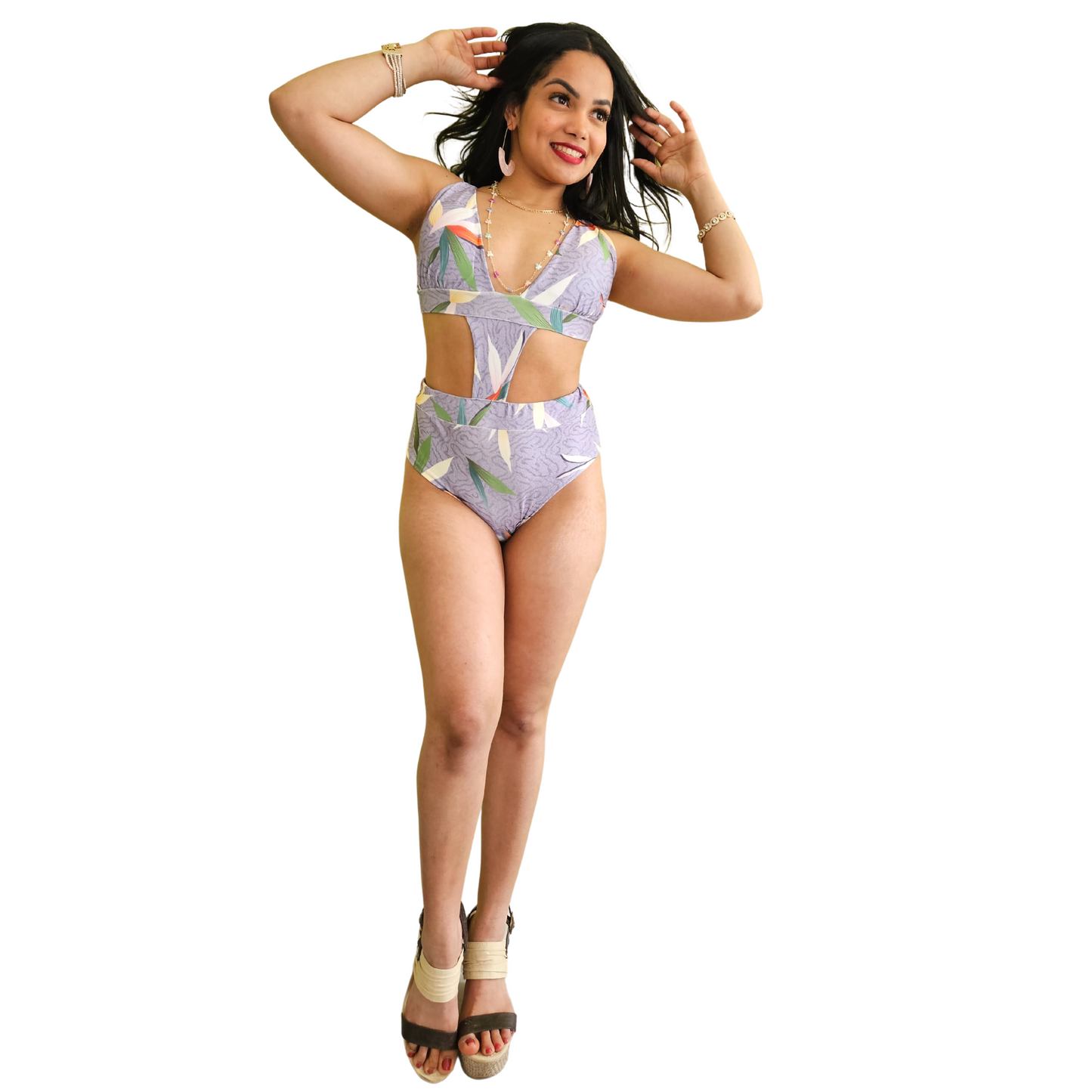 Stylish purple swimsuit with seashell pattern, side cut-out, and crisscross back ties